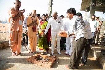 Dignitaries take part in prayers before commencing the event