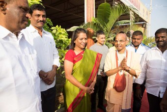 Government officials having a brief discussion on Outride Hunger