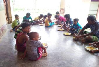 Children sit together for lunch