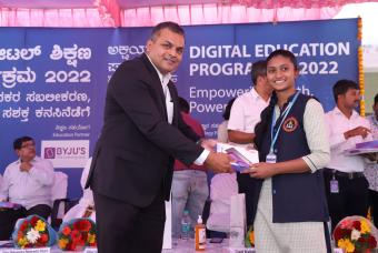 The beneficiary is happy to receive the tab from Mr Prasad Mokkarala – VP (Managed Services NTT)