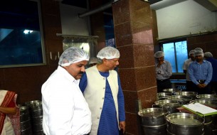 Prof. Yunus carefully watching the sterilised vessels for packing the cooked meals
