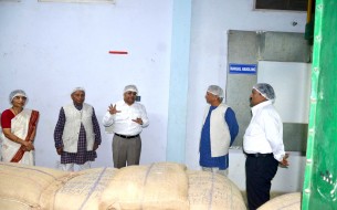 Sridhar explaining matters on storage and handling to the dignitaries