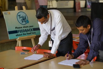 Techies filling the Feedback form after tasting Akshaya Patra food