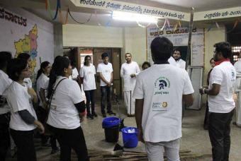 The volunteers discussing the task at hand