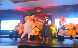Children from Murphy Town’s Government High School performing a skit and dance on Education
